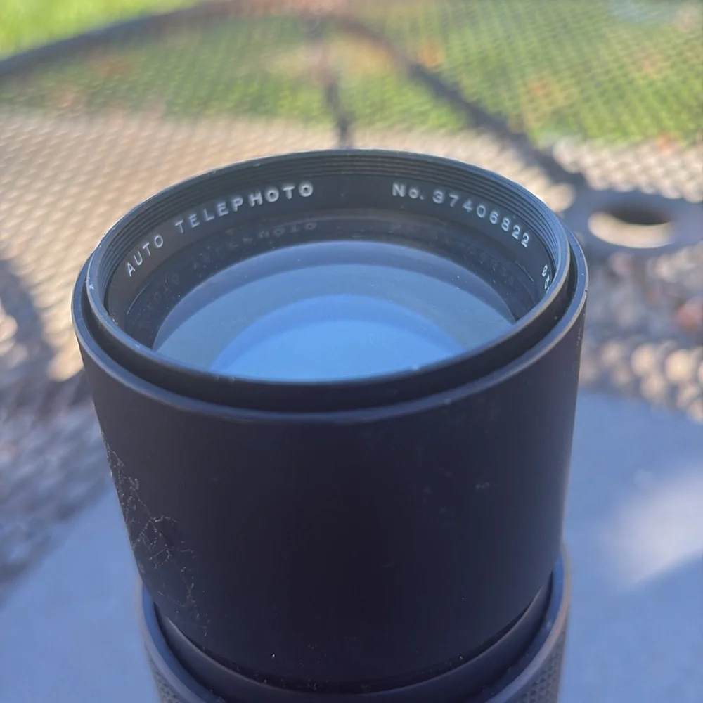 The image shows a Vivitar 300mm 1:5.6 lens. Additional information:
